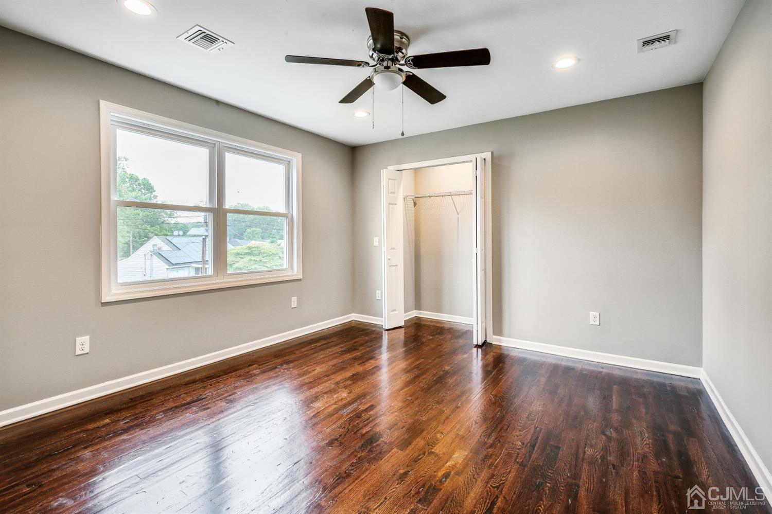 9 Markham Road Edison, NJ 08817 - Photo 26 of 28 a view of empty room with wooden floor and fan