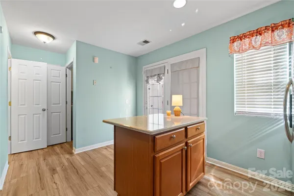 a kitchen with a sink and a window