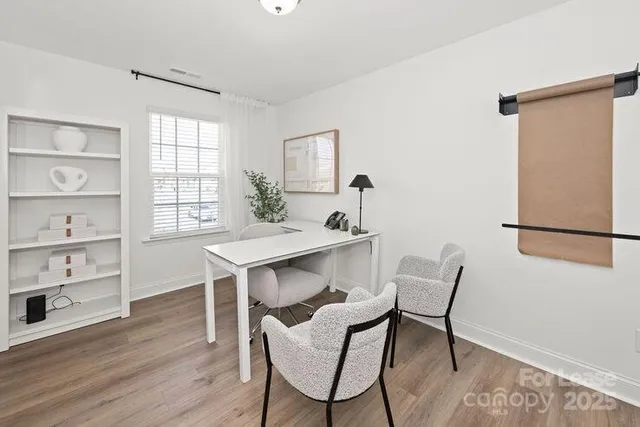 a bedroom with a bed and a night stand