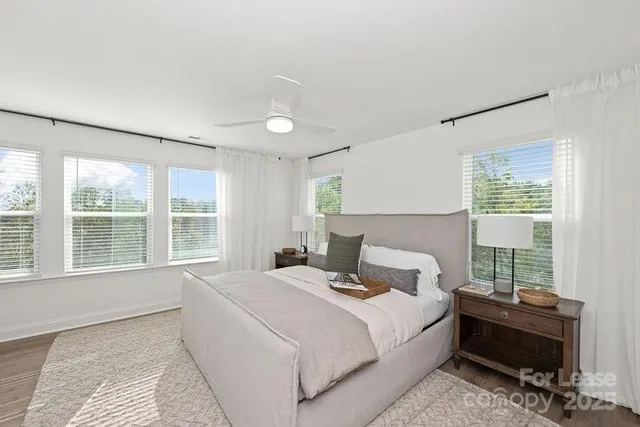 a bathroom with a double vanity sink mirror and shower