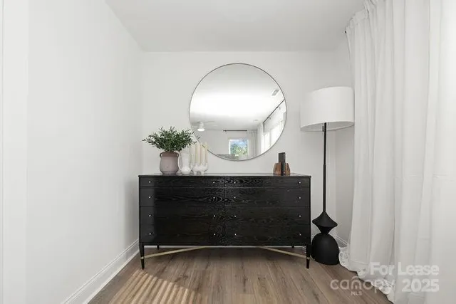 a bathroom with a sink a mirror and a shower