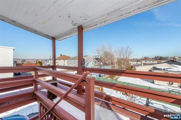 a view of a balcony with chairs