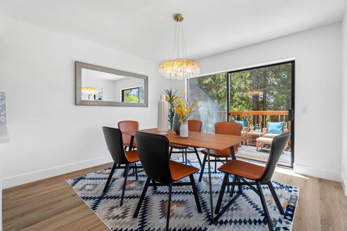 603 Sharp Park Road Pacifica, CA 94044 - Photo 6 of 27 a dining room with furniture a chandelier and wooden floor