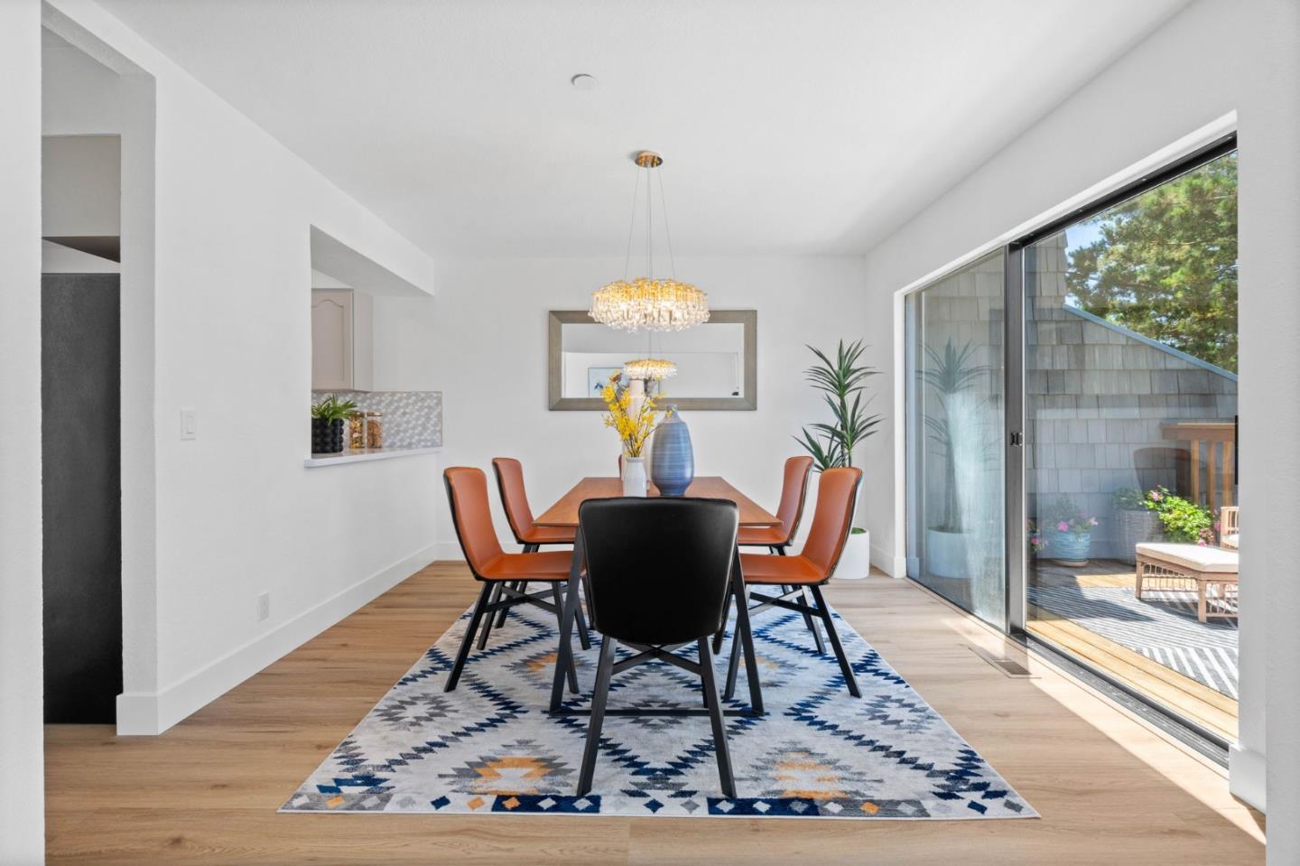 603 Sharp Park Road Pacifica, CA 94044 - Photo 8 of 27 a view of a dining room with furniture wooden floor and a rug