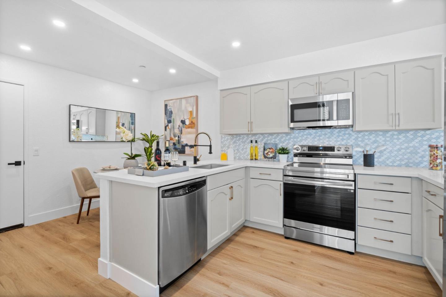 603 Sharp Park Road Pacifica, CA 94044 - Photo 10 of 27 a kitchen with stainless steel appliances granite countertop a sink stove and cabinets