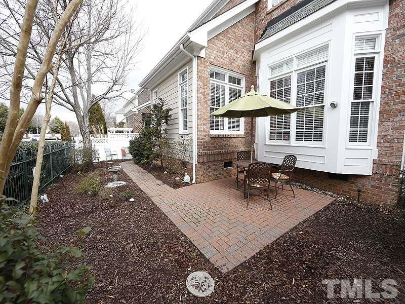 3909 Bentley Meadow Lane Raleigh, NC 27612 - Photo 22 of 24 a view of a house with backyard and sitting area