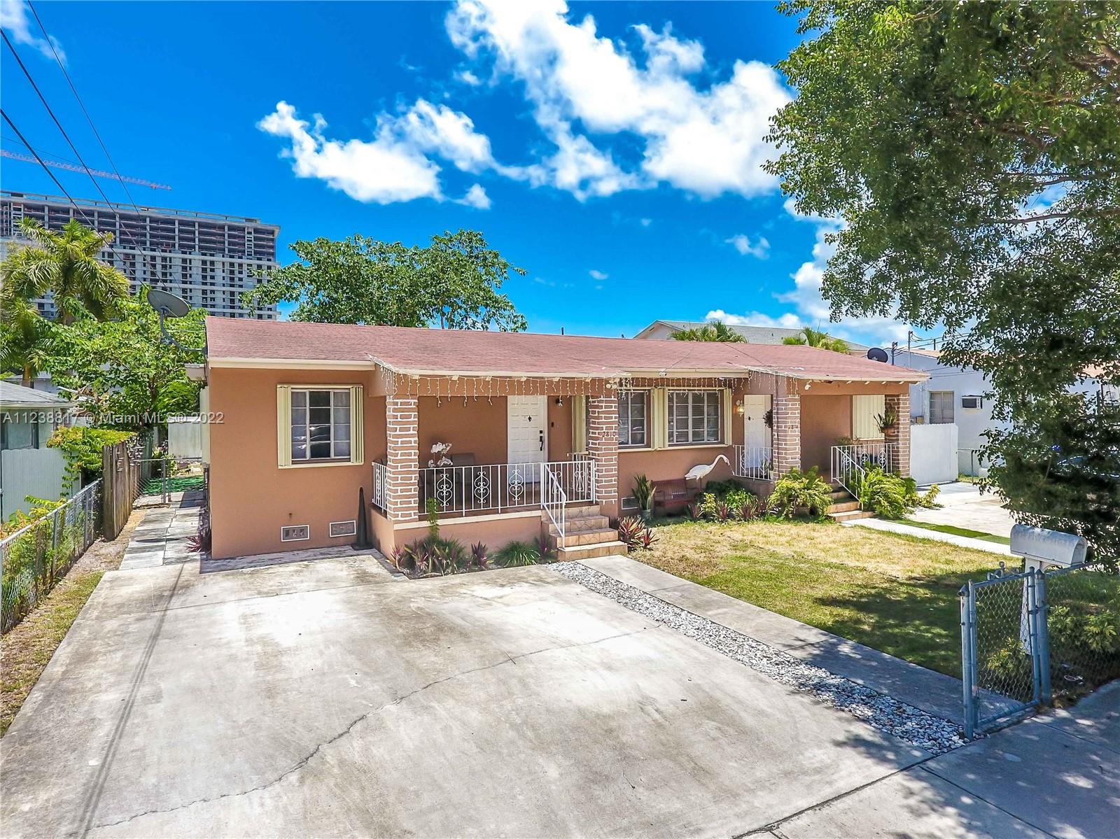 2810 Southwest 26th Street Miami, FL 33133 - Photo 1 of 33 a view of a house with backyard and sitting area