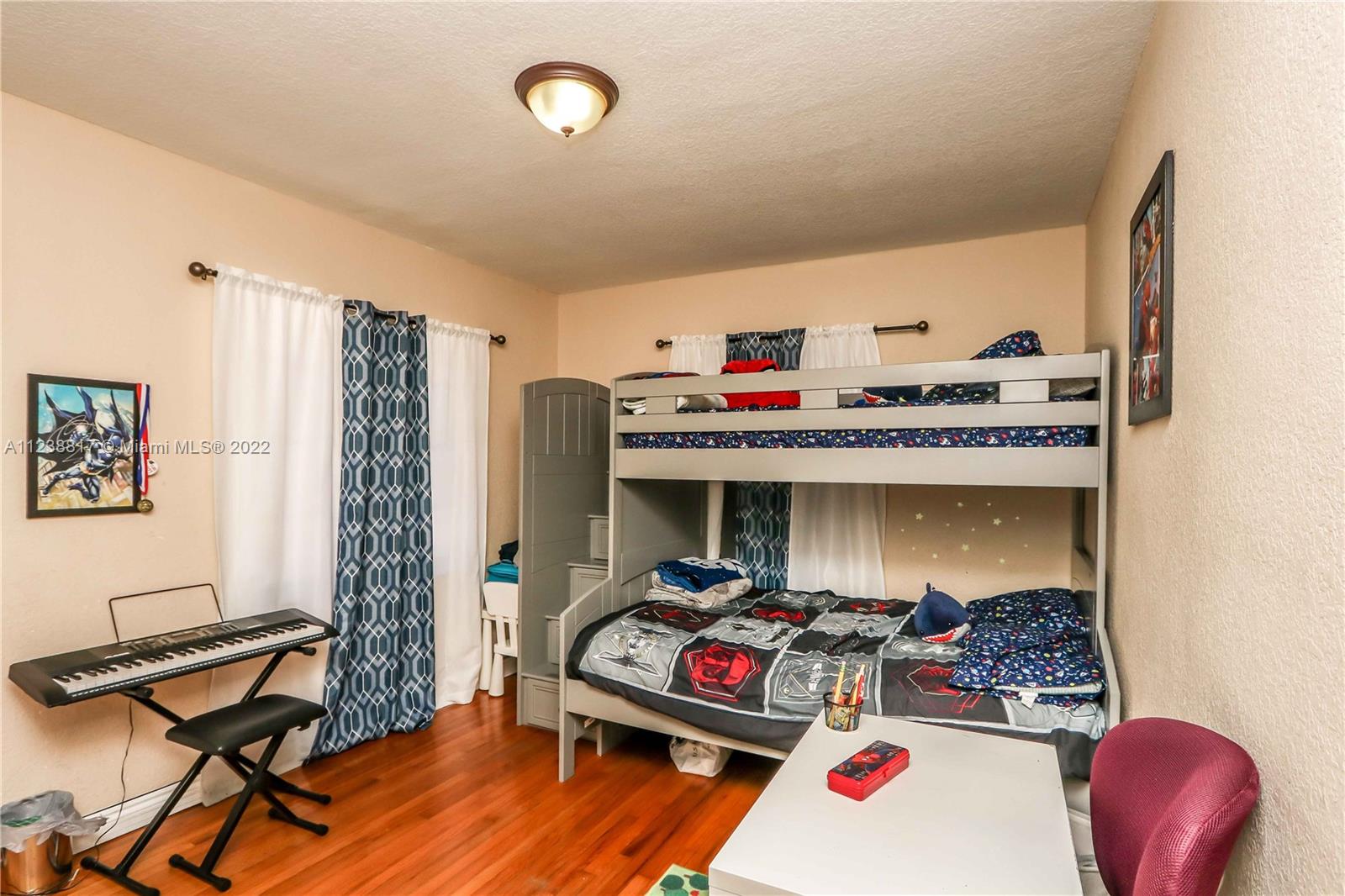 2810 Southwest 26th Street Miami, FL 33133 - Photo 16 of 33 a bedroom with furniture and a book shelf