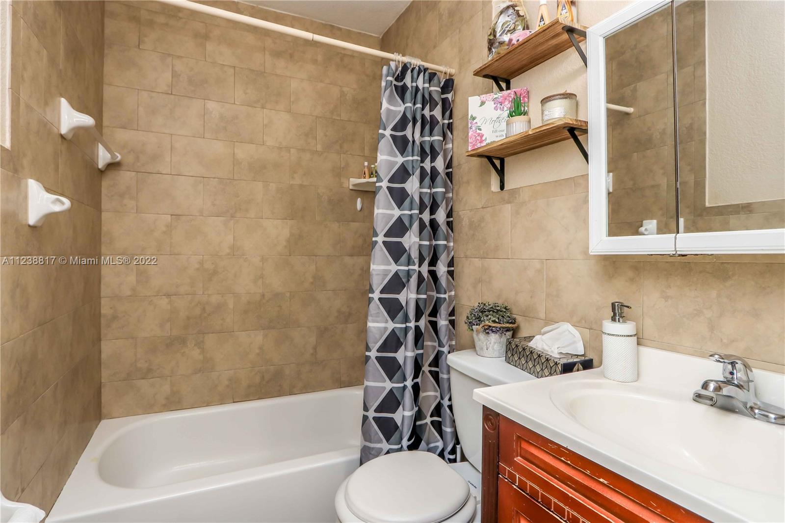 2810 Southwest 26th Street Miami, FL 33133 - Photo 18 of 33 a bathroom with a sink toilet and shower