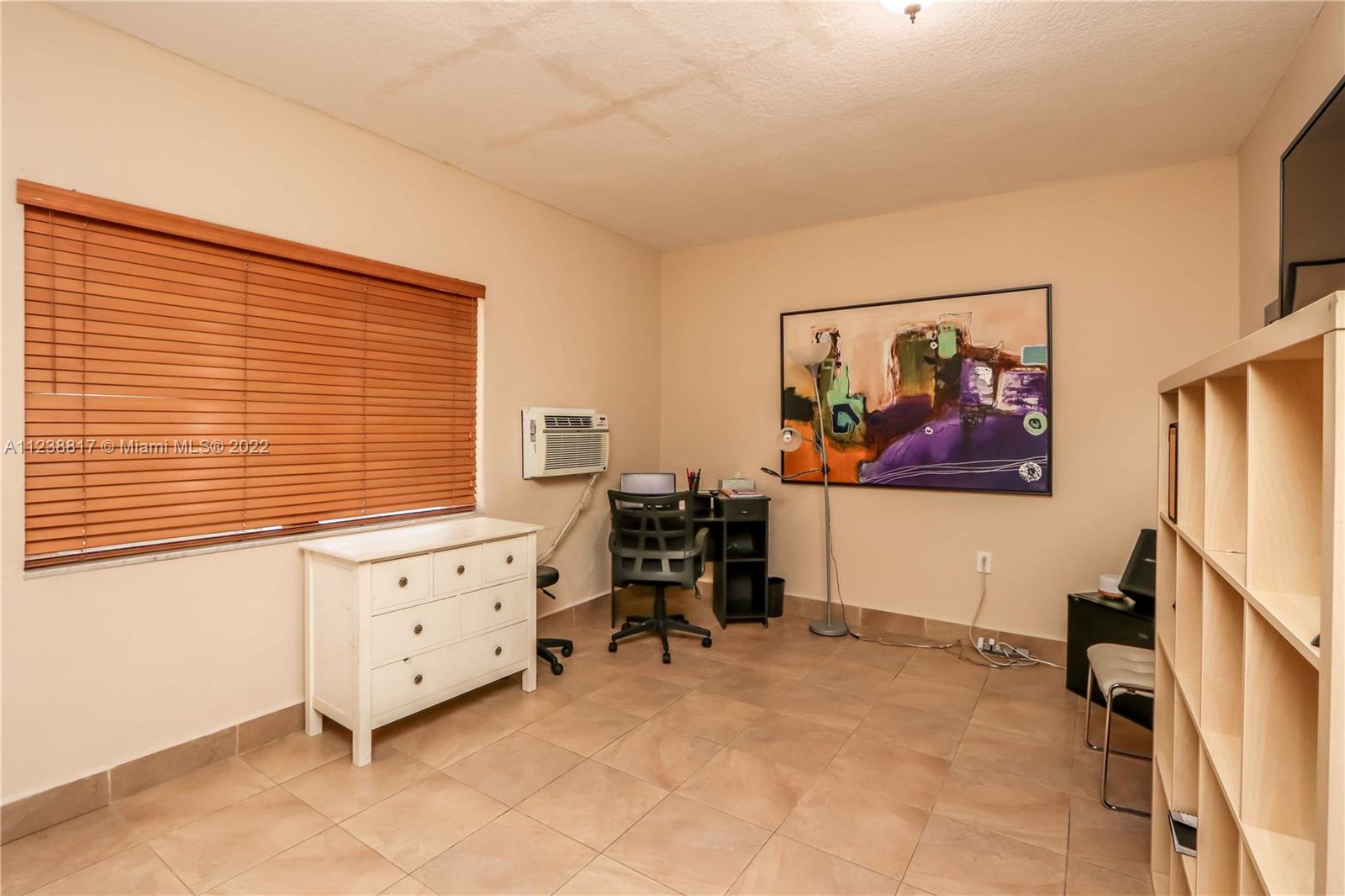 2810 Southwest 26th Street Miami, FL 33133 - Photo 19 of 33 a bed room with furniture and a window