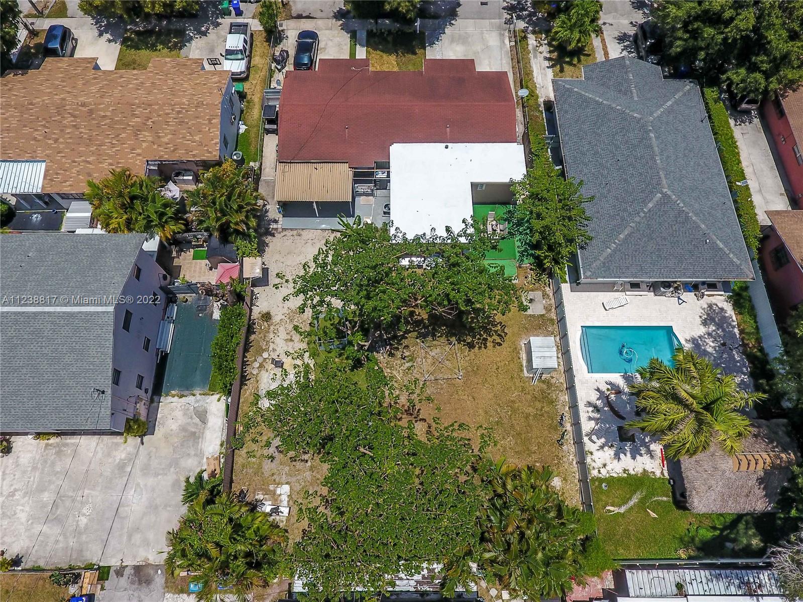 2810 Southwest 26th Street Miami, FL 33133 - Photo 2 of 33 an aerial view of a house with a yard and a garden