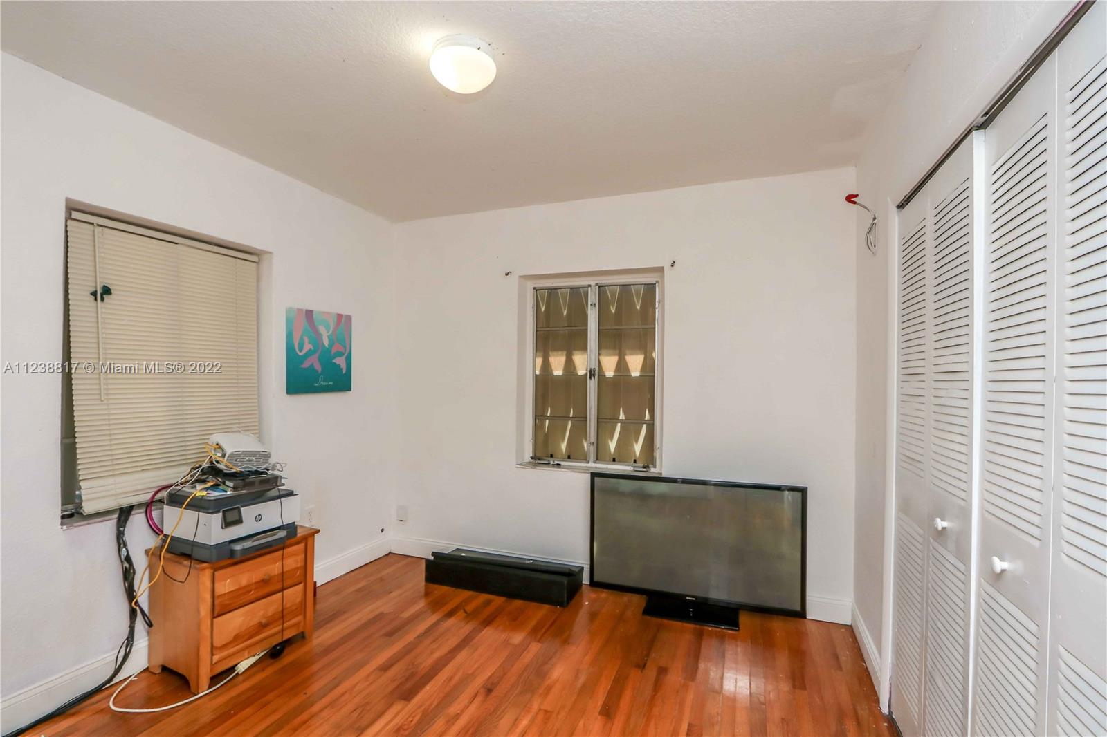 2810 Southwest 26th Street Miami, FL 33133 - Photo 31 of 33 a view of a livingroom with wooden floor and a window