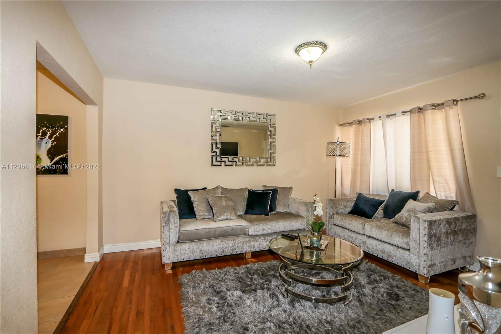 2810 Southwest 26th Street Miami, FL 33133 - Photo 9 of 33 a living room with furniture and a window