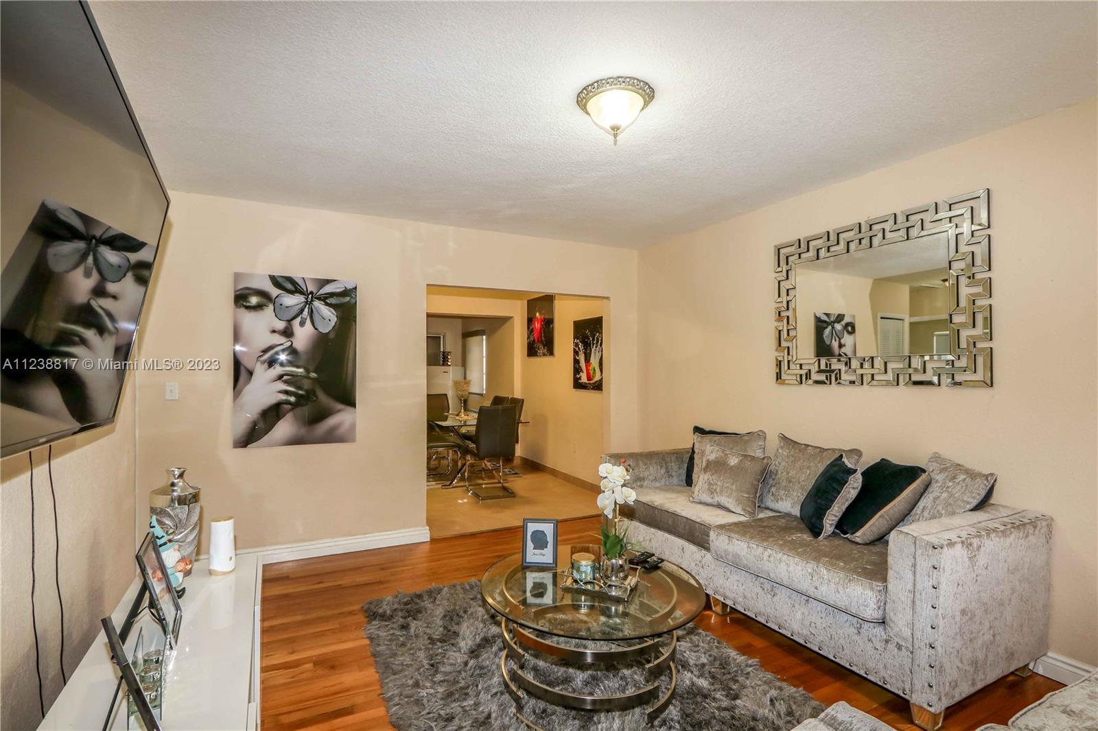 2810 Southwest 26th Street Miami, FL 33133 - Photo 10 of 33 a living room with furniture and a wooden floor