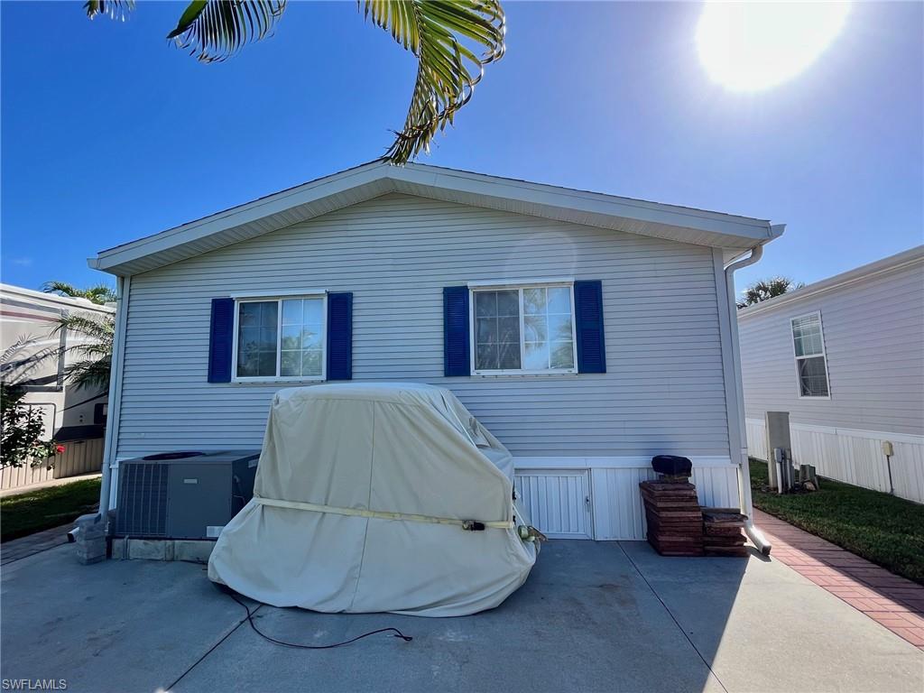 1453 Diamond Lake Circle Naples, FL 34114 - Photo 12 of 18 a house view with a backyard space