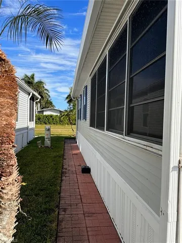 a view of a pathway both side of house