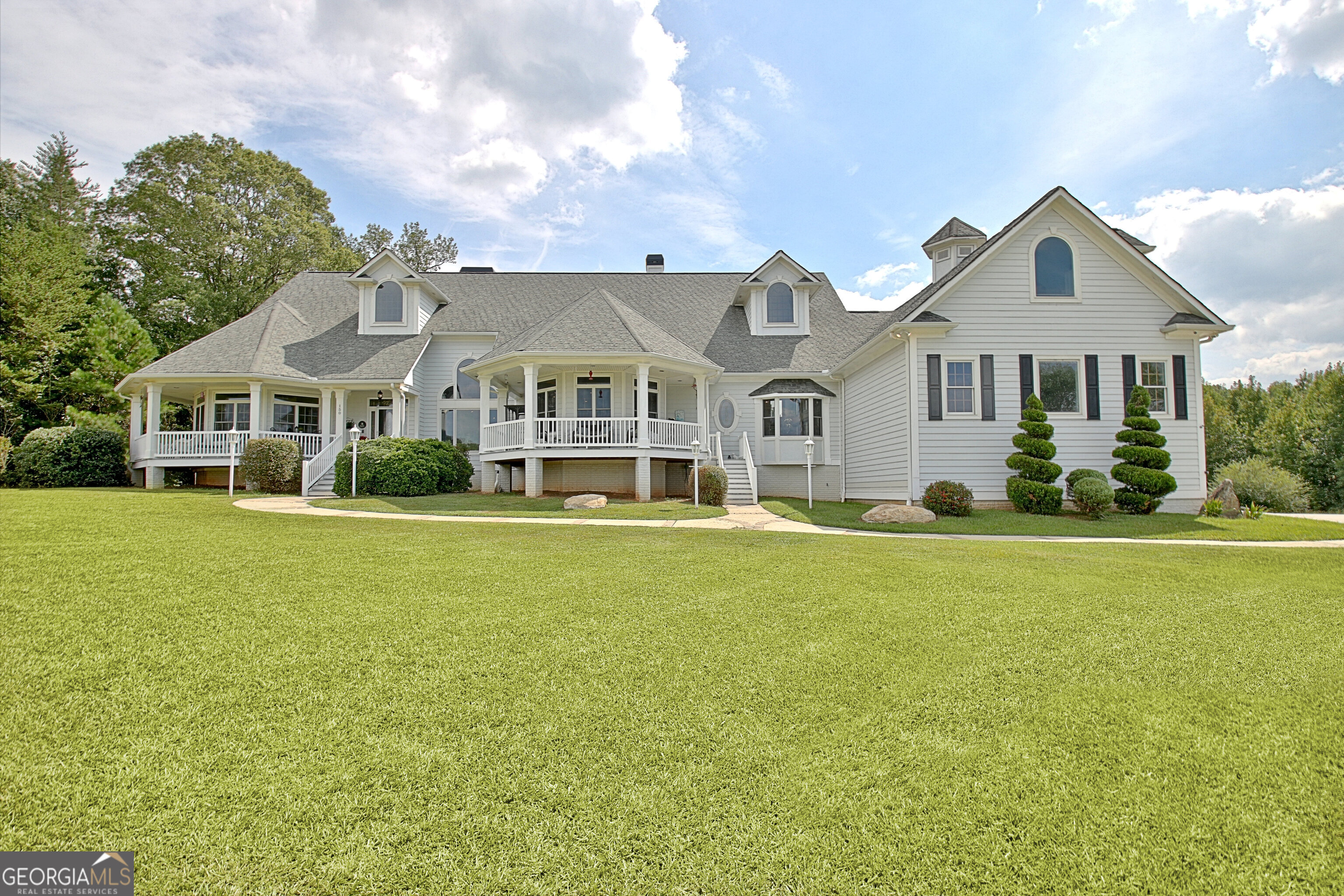 150 Kenley Drive Brooks, GA 30205 - Photo 1 of 1 a front view of a house with a garden and yard