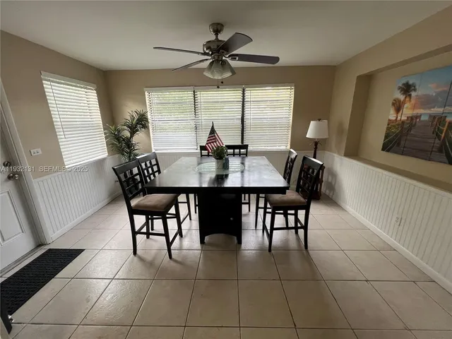 a view of a dining room with furniture and window