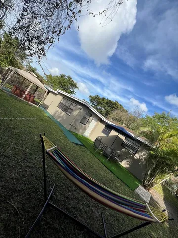 a view of a yard from a balcony