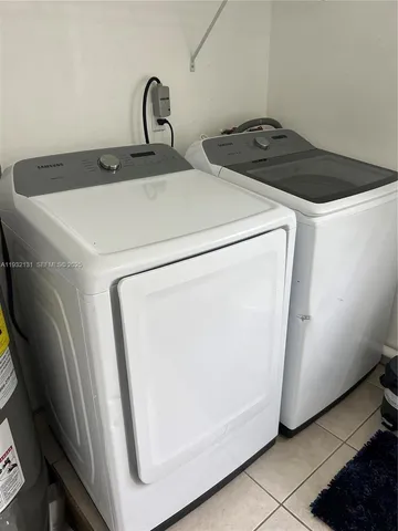a close view of sink a washer and dryer