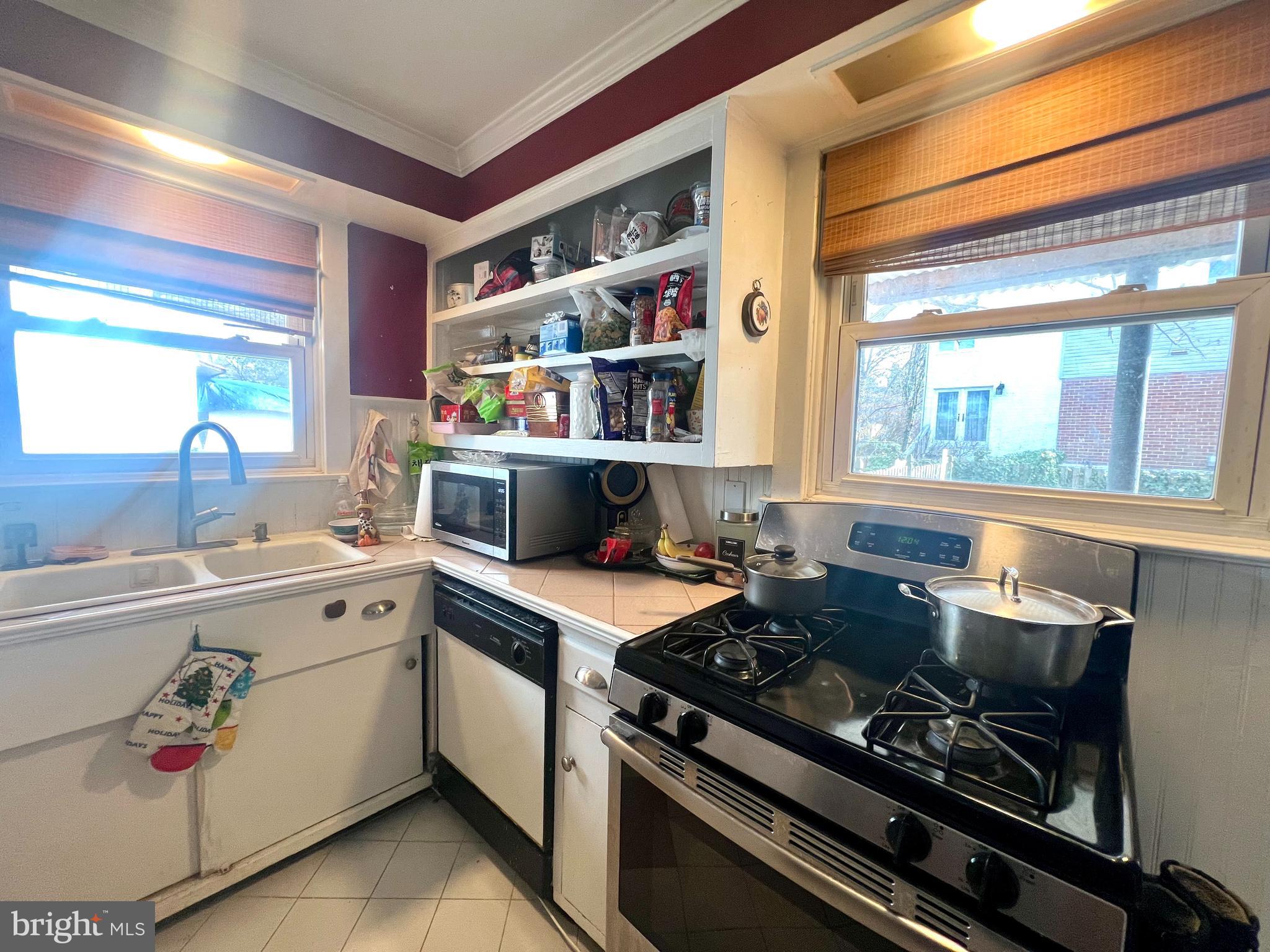 241 Rockingham Road Bryn Mawr, PA 19010 - Photo 3 of 17 a kitchen with a stove and a sink