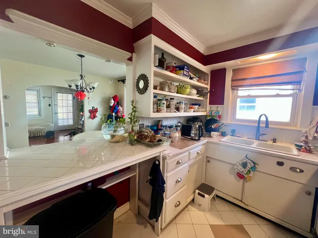 a kitchen with a sink and cabinets