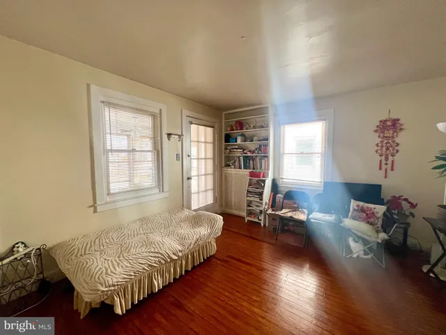 a bedroom with a bed furniture and a window