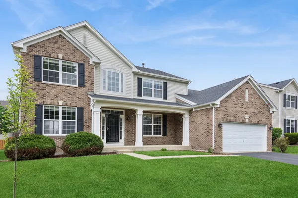 front view of a house with a yard