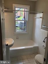 1630 16th Street Southeast, Unit 2 Washington, DC 20020 - Photo 13 of 15 a bathroom with a shower a toilet and a tub