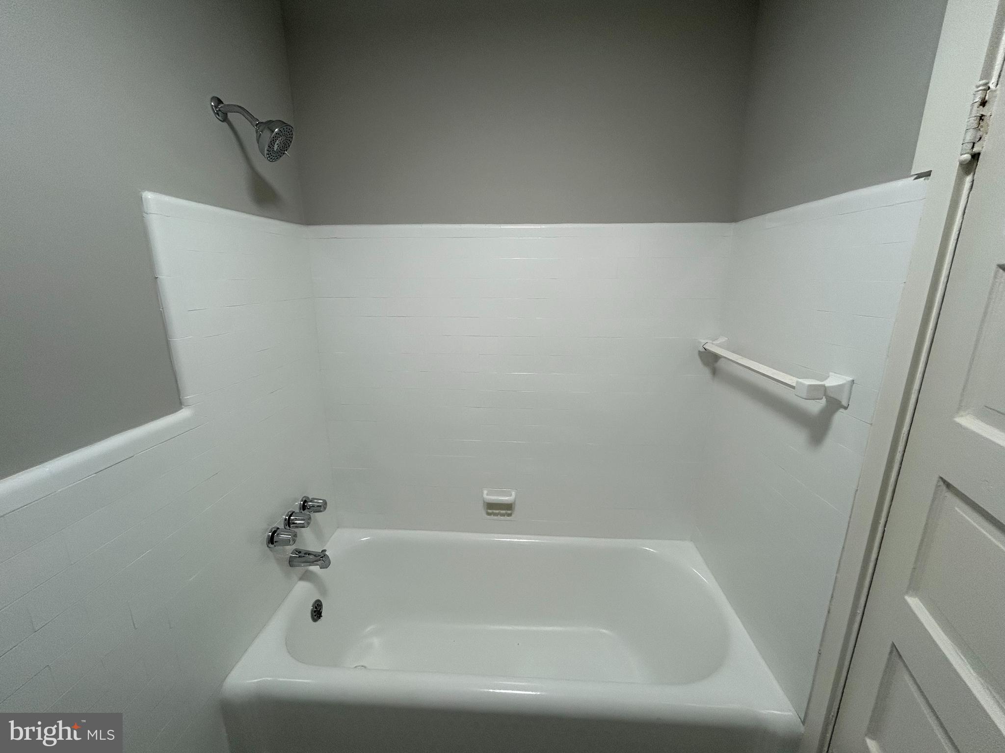 1630 16th Street Southeast, Unit 2 Washington, DC 20020 - Photo 14 of 15 a bathroom with a bathtub