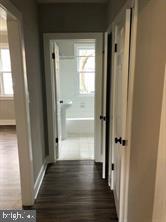 1630 16th Street Southeast, Unit 2 Washington, DC 20020 - Photo 2 of 15 a view of a hallway with wooden floor and a bathroom
