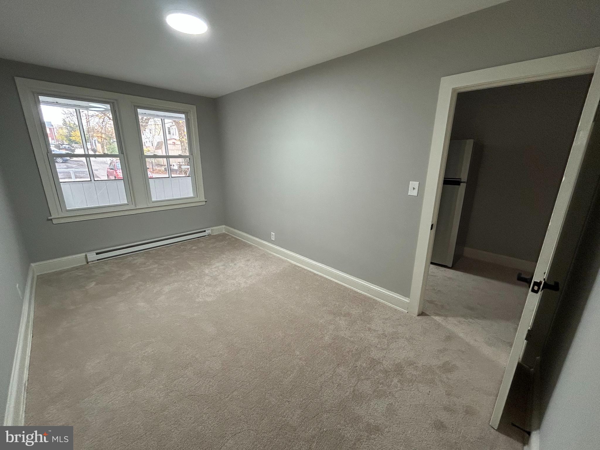 1630 16th Street Southeast, Unit 2 Washington, DC 20020 - Photo 6 of 15 an empty room with windows