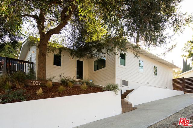 a front view of a house with yard