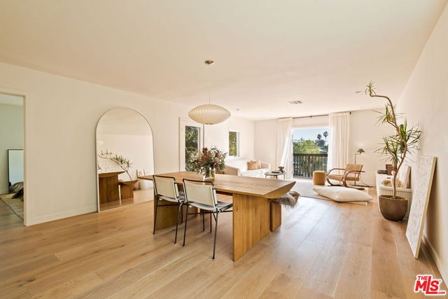 a view of a living room with furniture and a window