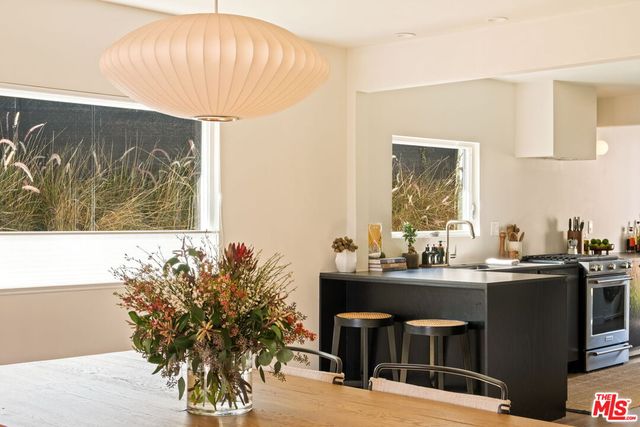a kitchen with a stove and a refrigerator