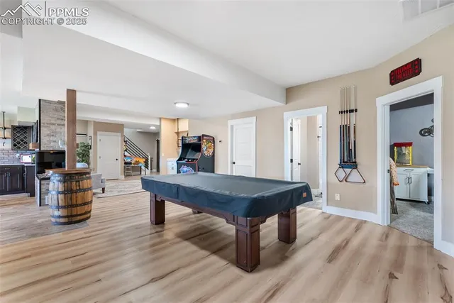 a living room with furniture wooden floor and a table