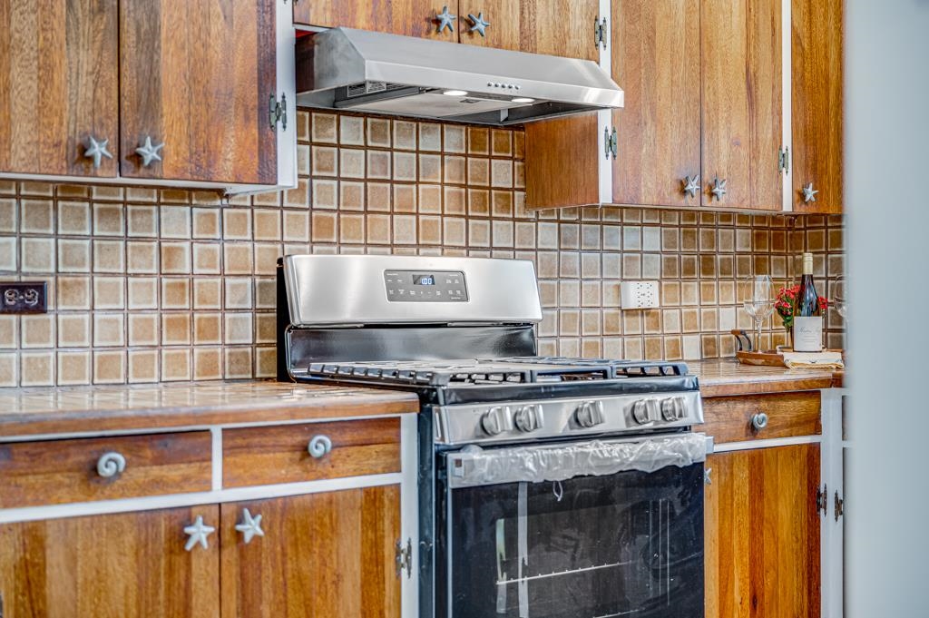 720 Mopua Street Haiku, HI 96708 - Photo 11 of 22 a kitchen with a stove and a sink