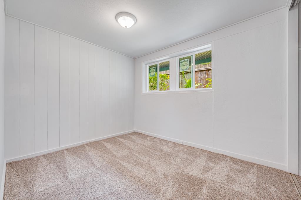 720 Mopua Street Haiku, HI 96708 - Photo 14 of 22 an empty room with windows