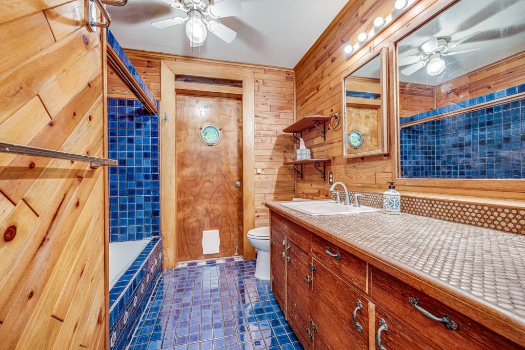 720 Mopua Street Haiku, HI 96708 - Photo 17 of 22 a bathroom with a sink a mirror and a shower