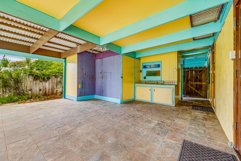 720 Mopua Street Haiku, HI 96708 - Photo 21 of 22 a view of a porch with a floor to ceiling window and an entrance
