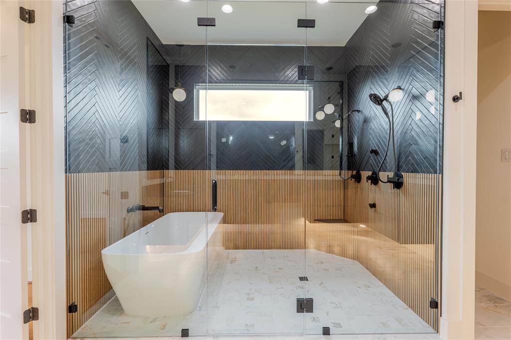 2005 Denali Pass Aledo, TX 76008 - Photo 24 of 36 a bathroom with a bathtub and a shower