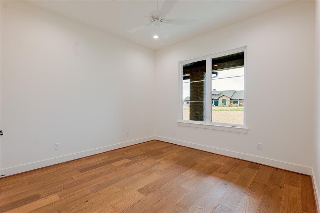 2005 Denali Pass Aledo, TX 76008 - Photo 29 of 36 an empty room with wooden floor and windows