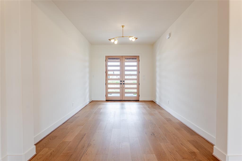 2005 Denali Pass Aledo, TX 76008 - Photo 5 of 36 an empty room with wooden floor and windows