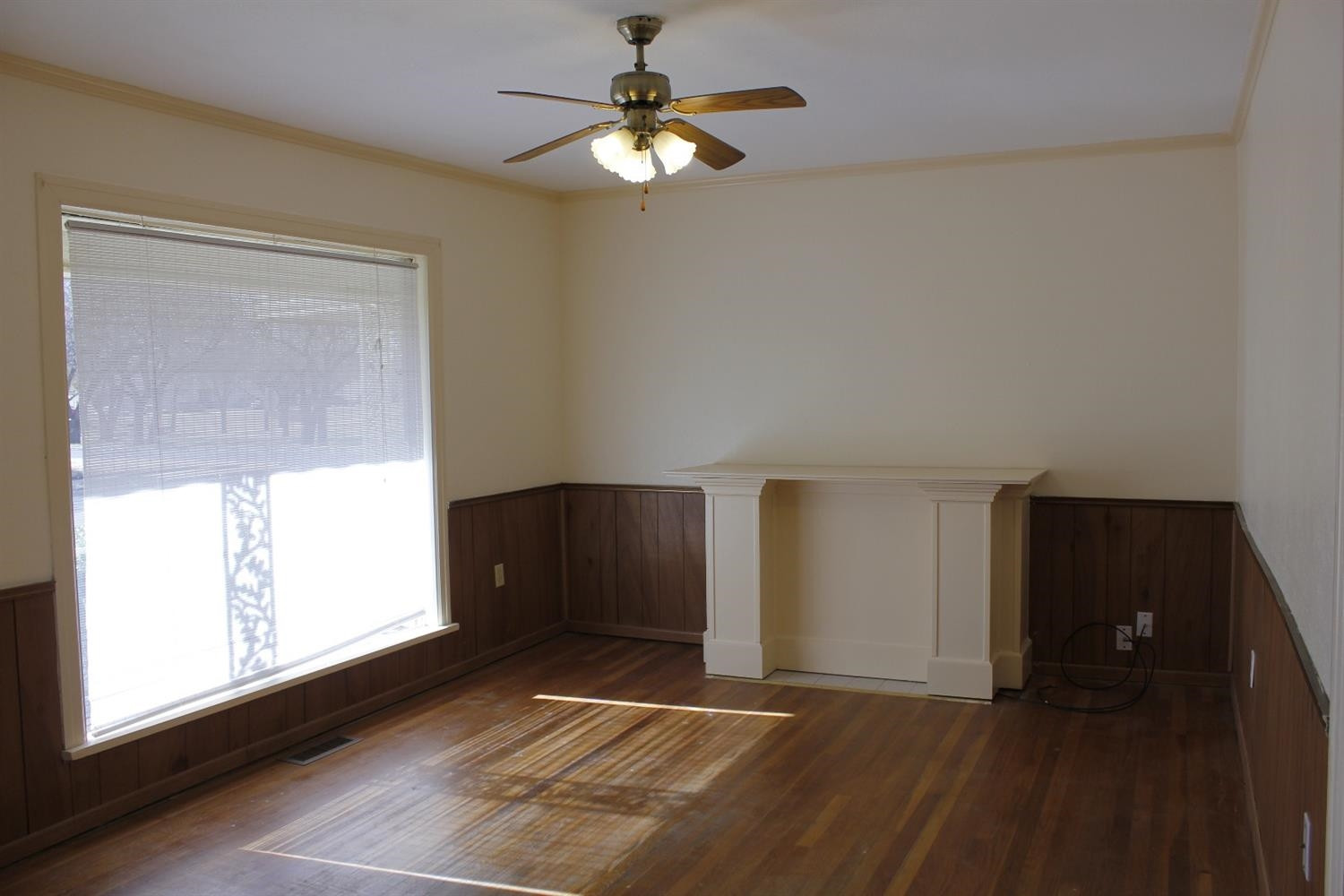 2222 22nd Street Lubbock, TX 79411 - Photo 2 of 9 a view of a livingroom with a ceiling fan and window