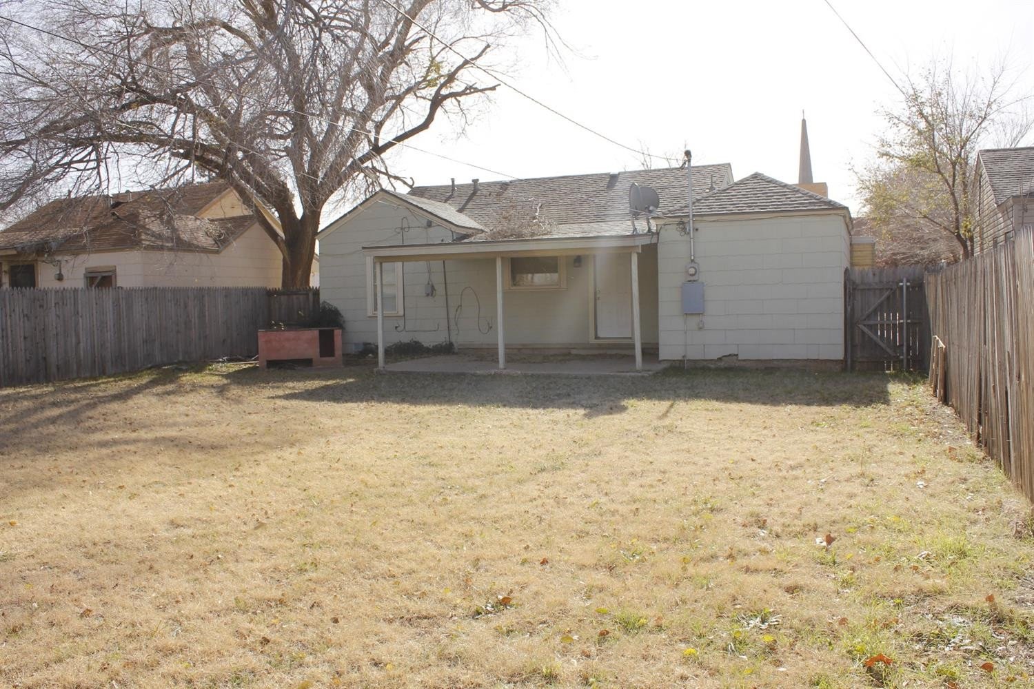 2222 22nd Street Lubbock, TX 79411 - Photo 9 of 9 a house that has a tree in front of it