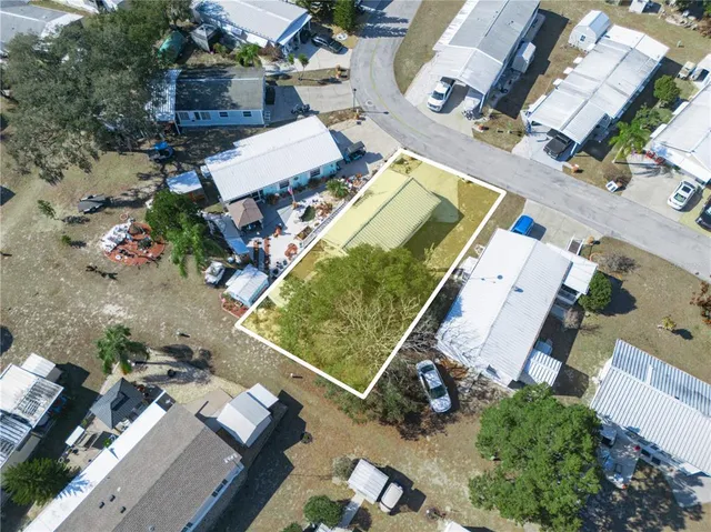 an aerial view of a house with a garden