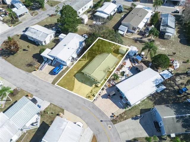 an aerial view of a house with a swimming pool