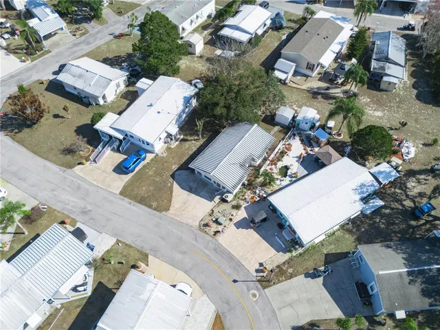 an aerial view of a house with outdoor space