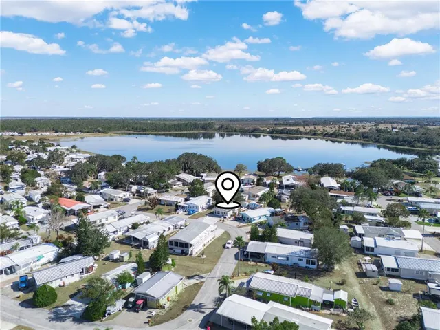 an aerial view of a house with a ocean view