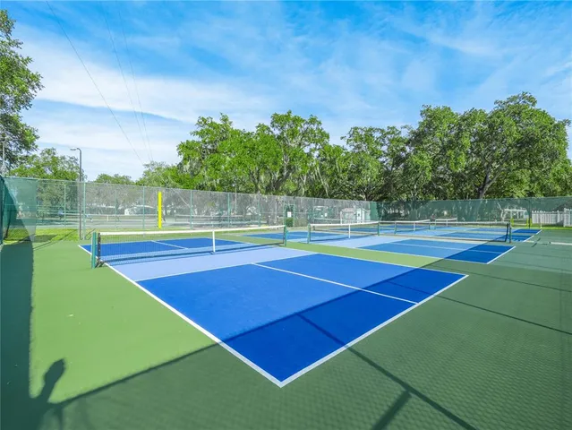 a view of street with houses and trees